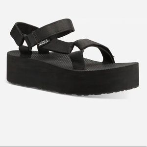 Black platform sandals by Teva